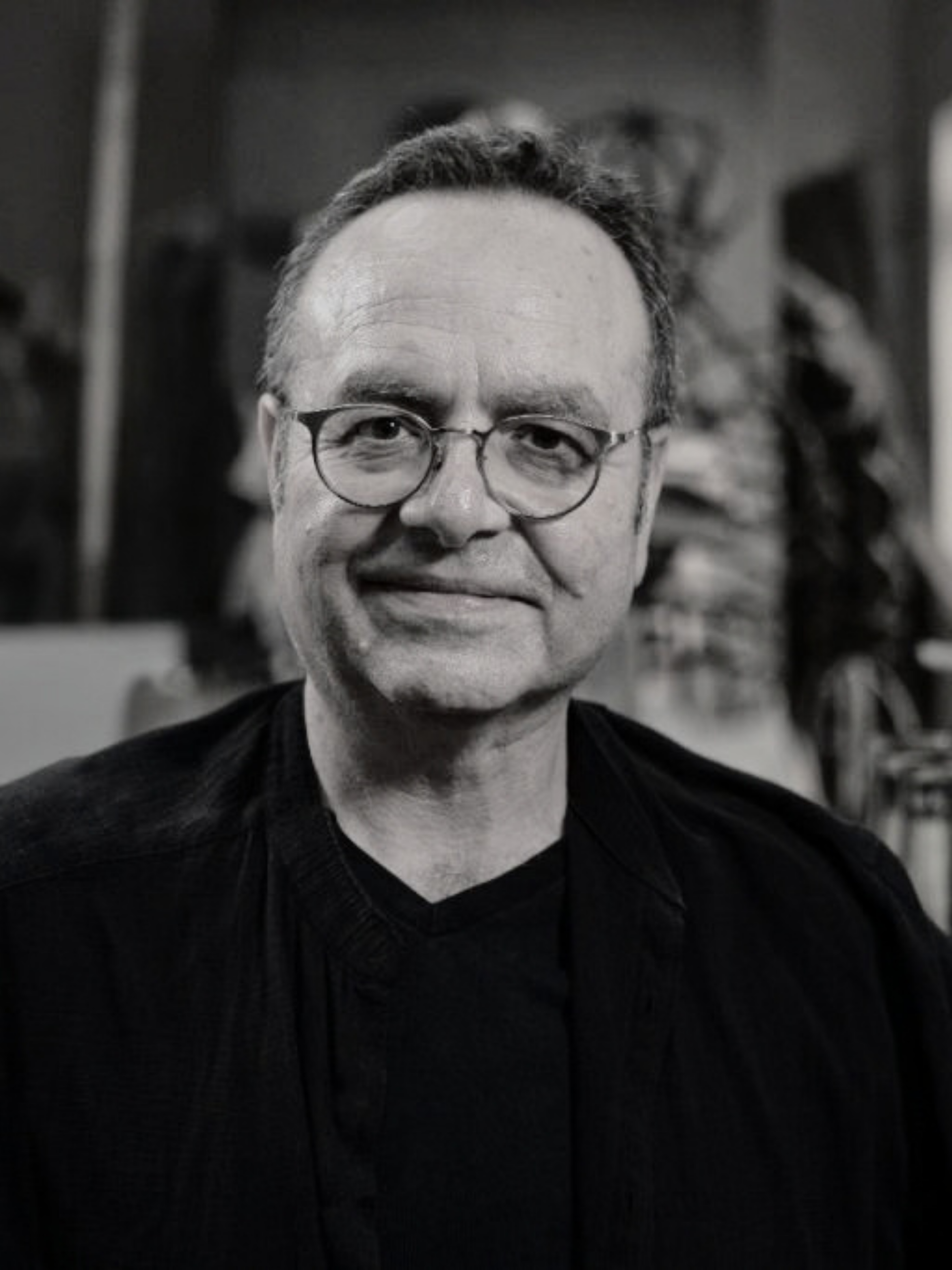 Documentary portrait of artist Pierre Portelli handling restored archival papers